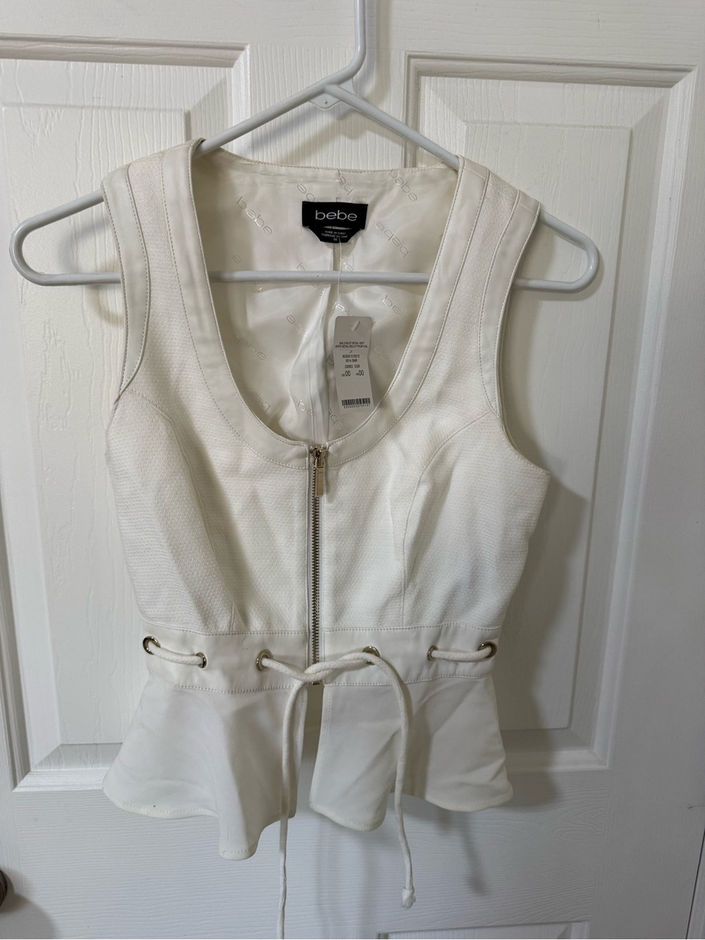 bebe White Sleeveless Zip-Front Peplum Top